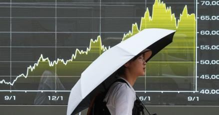 Asian benchmarks trade mixed following rally on Wall Street led by technology issues