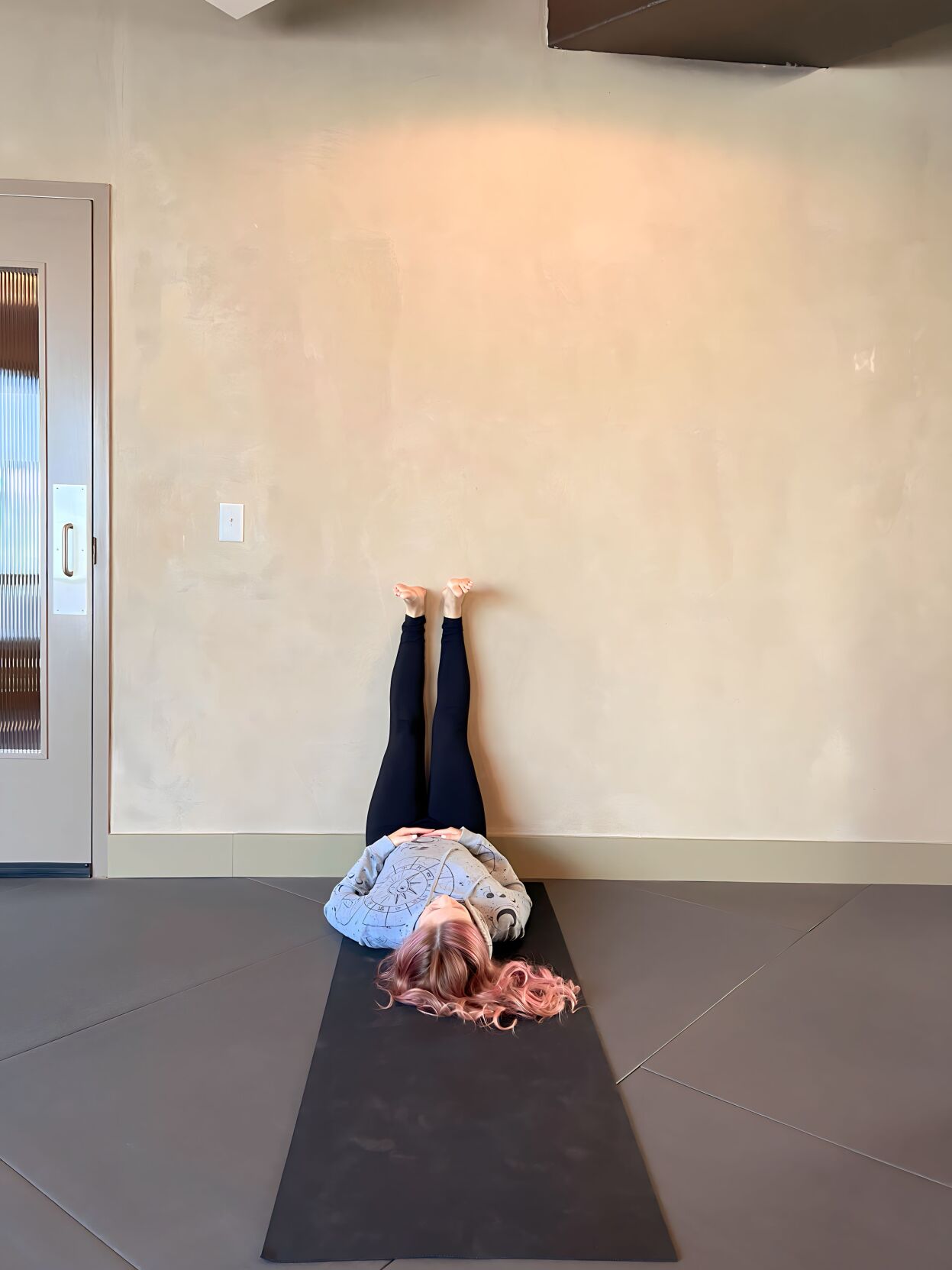 To practice lega up the wall pose, lie down near a wall and extend you... |  TikTok