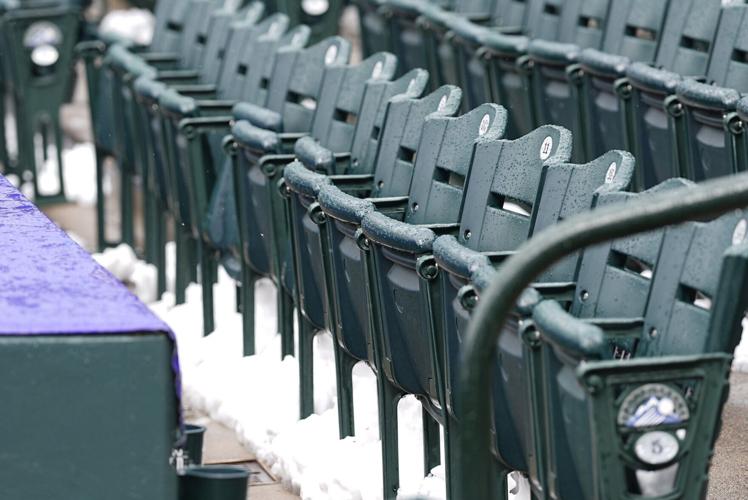 Snow blankets Coors Field before chilly MarinersRockies game in Denver