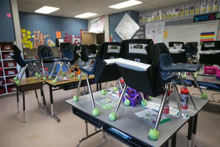 Student chairs are put away in an empty classroom at Robertson Elementary School Monday, March 16, 2020, in Yakima, Wash. All 15 Yakima County school districts announced they are canceling classes starting Monday, March 16. 