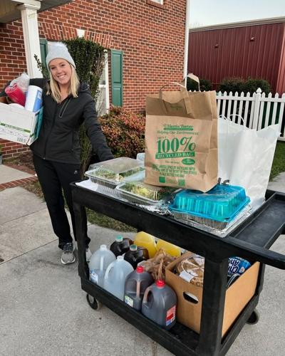 Allison Jarrell at Leslie’s House delivering food as part of the Dinner with the League program