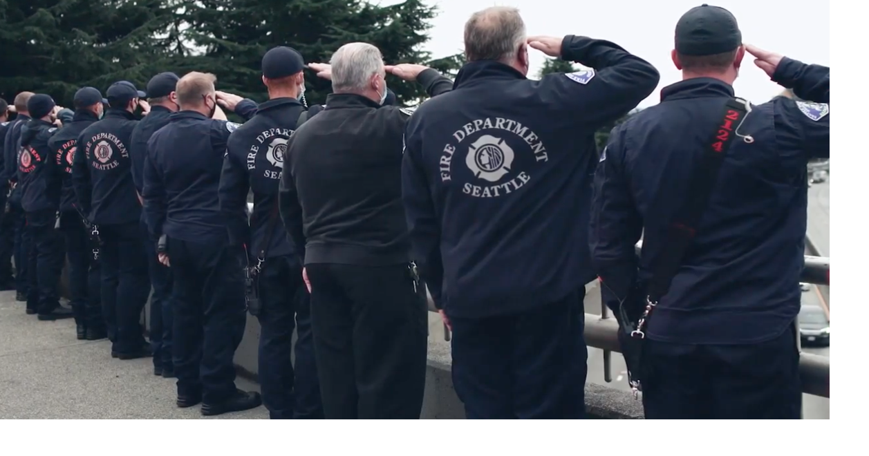 Firefighters line overpasses as fallen Seattle deputy fire chief