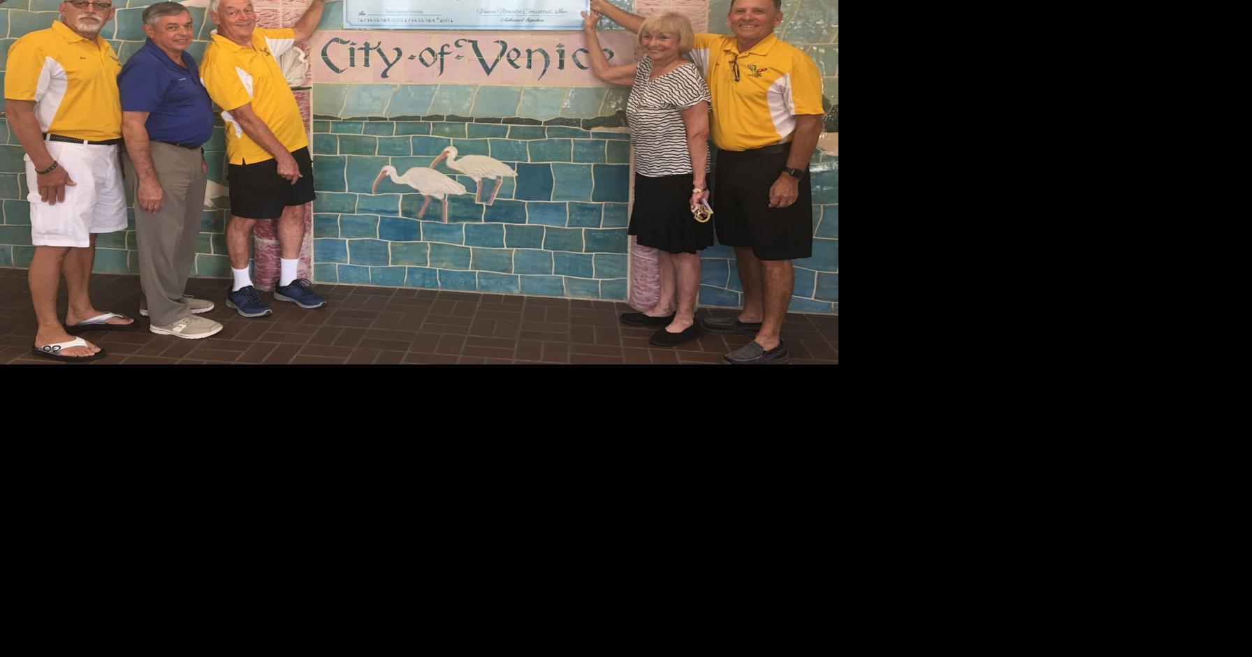 Venice Florida Corvettes present check to local food pantries The