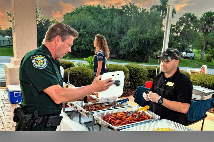 Charlotte County Sheriff's Office Capt. Todd Davis receives a complimentary breakfast from Frank Quinones