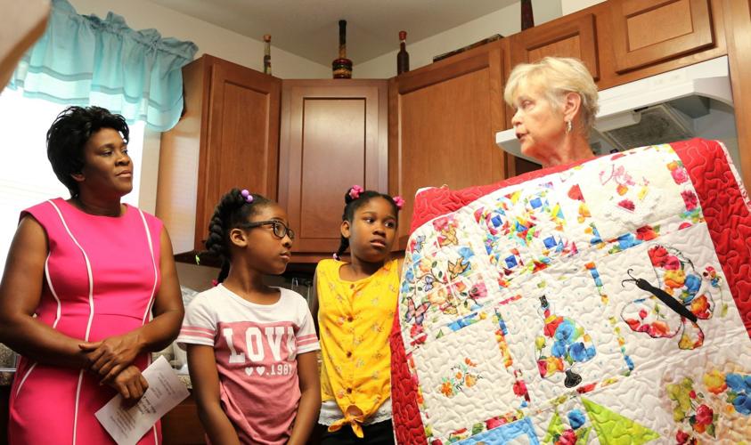 Single mother of three gets Habitat home Daily Break