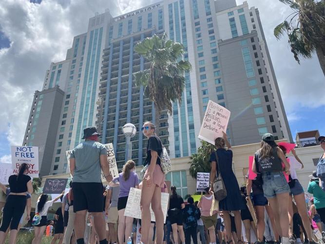 Protesters gathered outside a Moms for Liberty event in Tampa