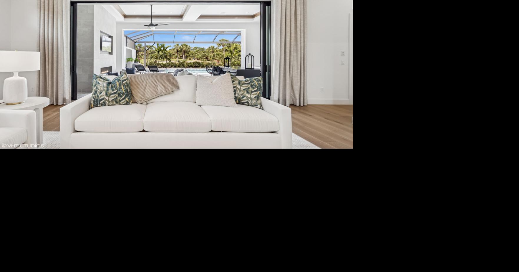 With its elegance and ease, this custom home showcases a refined ...