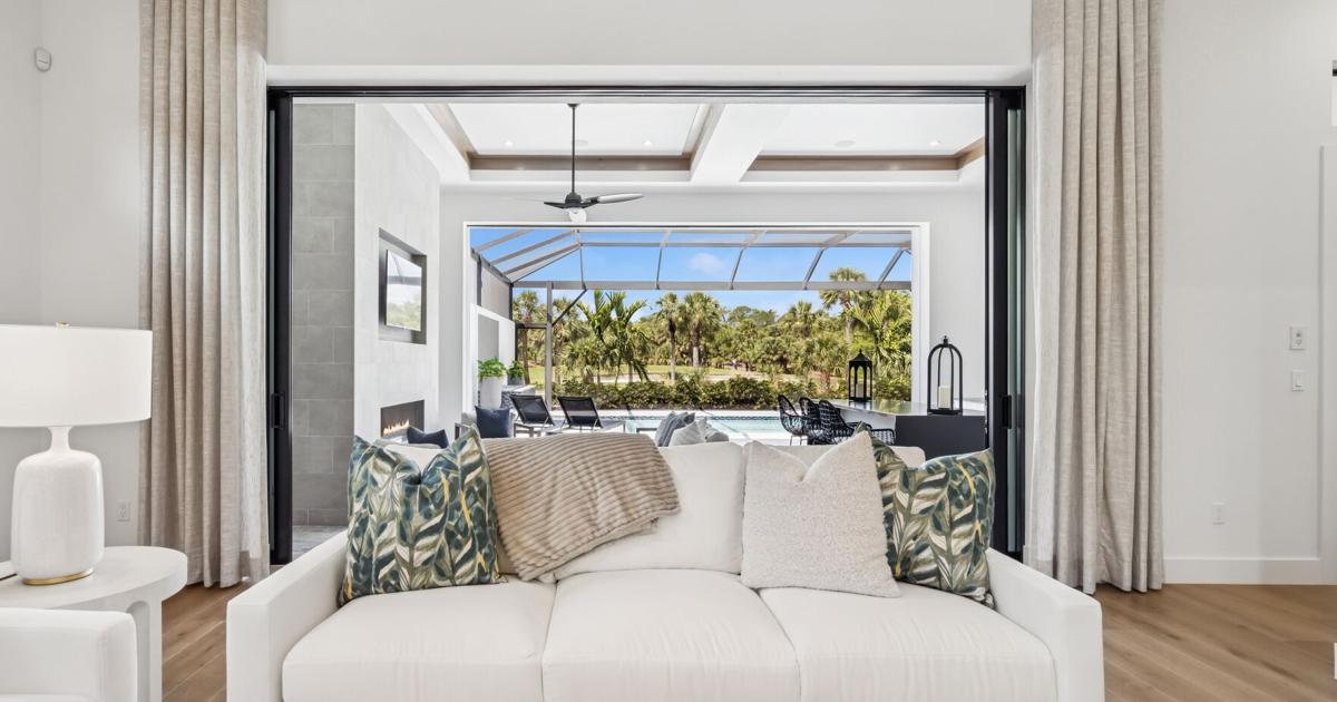 With its elegance and ease, this custom home showcases a refined ...