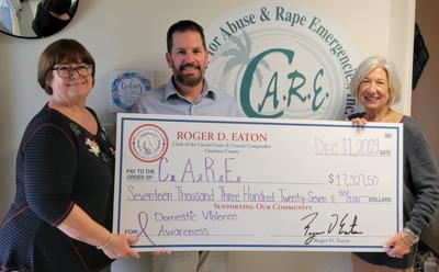 Clerk #39 s office donates money to C A R E Port Charlotte News
