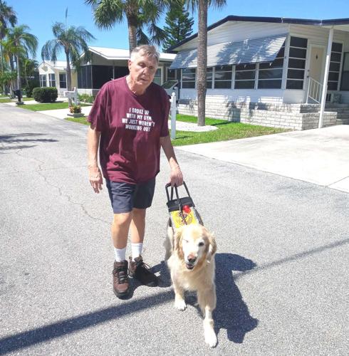 Tom Hanson with his retired guide dog Marco