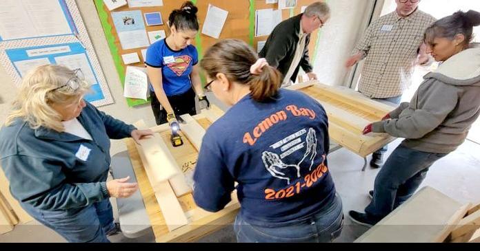 Kiwanians builds beds for kids in need