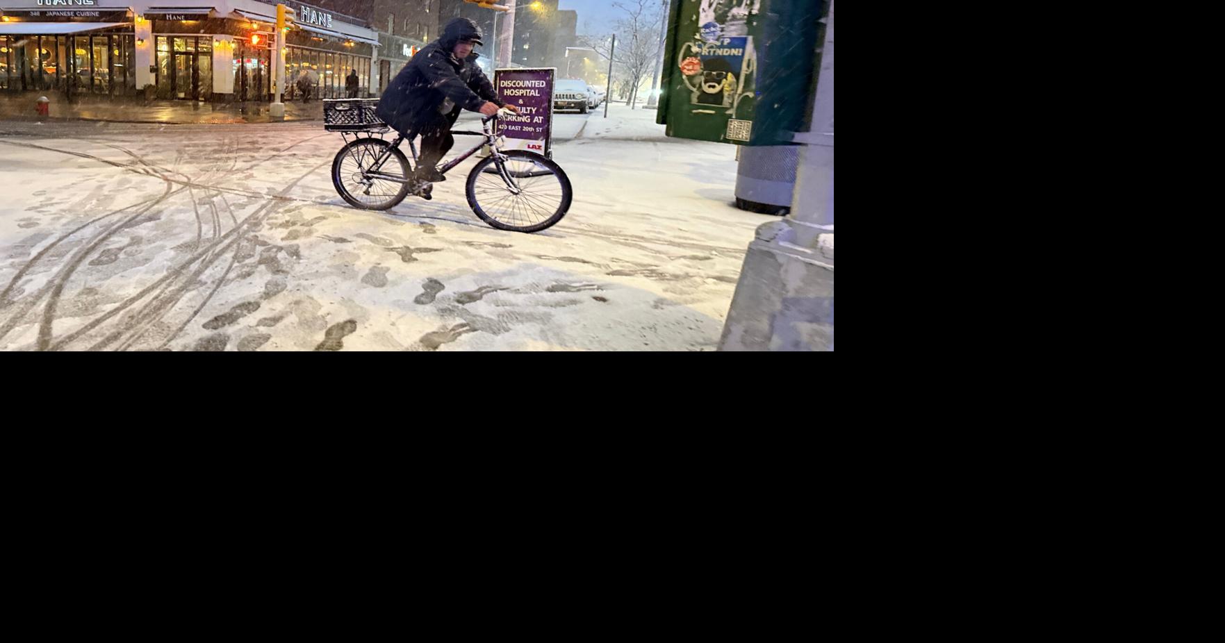 New York City hunkers down under blizzard warnings and a travel ban as winter storm hits northeast