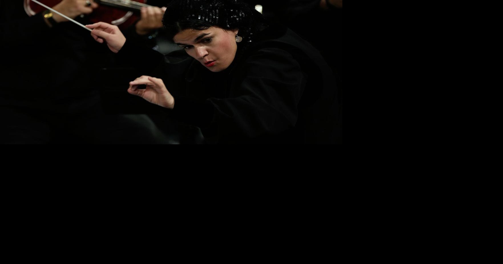 Photos of the first female conductor to lead a Tehran Symphony Orchestra performance